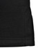 A close-up of a black sustainable poly/cotton polo shirt, featuring a neatly finished hem and a tag on the fabric.