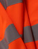 An orange safety vest with grey reflective shoulder tapes, showcasing its bright, high-visibility fabric.