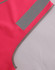 A bright pink safety vest featuring reflective shoulder tapes and contrasting grey edging. It includes a logo.