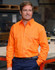 A bright orange men's long-sleeve drill shirt with two front pockets and a logo, set against an industrial background.