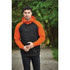 A men's zip hoodie in black and orange, featuring a hood and contrasting sleeves, set in a natural outdoor environment.
