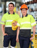A unisex safety polo shirt featuring fluorescent yellow and dark grey segments, with reflective stripes. Includes a logo.