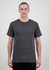 A grey short sleeve men’s tee worn by a model, featuring a simple design and no visible logos.