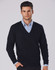A black V-neck wool and acrylic knit jumper worn over a blue collared shirt, featuring a branding logo.