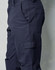 Men's cargo pants in navy blue, featuring knee pads and multiple pockets, with a sleek, fitted design.
