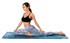 A yoga towel featuring a geometric design in blue, laid out on the ground with a model performing a stretch.