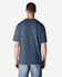 A back view of a blue Gildan Softstyle adult t-shirt, showcasing a simple design and relaxed fit.