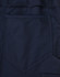 A close-up of navy pants featuring a segmented design and a rear pocket. The fabric has a ripstop texture.