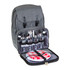 A grey backpack opened to reveal glassware, cutlery, plates, and a gingham cloth inside. It features a logo.