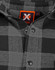 A black and grey plaid unisex flannel button-up shirt featuring a logo on the label.