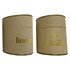 A large candle in a cylindrical kraft paper container with gold accents, labelled 'linen'.