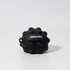 A black textured stress ball featuring bumps and a loop for attachment, with a small logo on its surface.