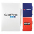 A collection of three notebooks in white, blue, and red, each featuring a logo and a pen attached.