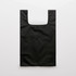 A black reusable grocery bag with a simple design and a button closure at the top.