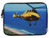 A vibrant laptop sleeve featuring a yellow helicopter flying over a coastal scene, with a black zipper.