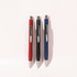 Three ballpoint pens in red, black, and blue, featuring sleek designs and silver clips, displayed against a light background.
