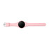 A pink pedometer with a circular black display and a strap featuring multiple holes for adjustment.