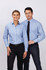 A ladies’ long sleeve button-up shirt in light blue with white stripes, worn by a model next to a man in a tie.