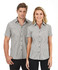 A short sleeve button-up shirt in a black and white checked pattern, featuring a logo.