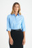A blue ladies' 3/4 sleeve button-up shirt with a classic collar, styled with a black skirt. Features a small logo.