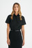 A black button-up short sleeve shirt for ladies, featuring a collar and a sleek fit. It has a logo on the garment.