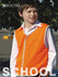 A high-visibility orange safety vest worn by a child, featuring a logo.