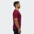 A unisex TRENDSWEAR Element T-shirt in maroon, viewed from the side, featuring a simple design and branding.