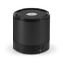 A compact black Bluetooth speaker featuring a mesh top and control buttons on the base, along with a logo.