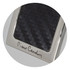 A sleek key ring featuring a textured black surface and a metallic silver frame, with branding.