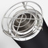 A black cooking pot with a silver grill lid, featuring a circular shape and a shiny metal interior.