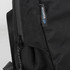 A black laptop bag with textured fabric and a zipper, featuring a logo on the side.