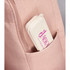 A bamboo fibre cutlery set in a beige case with a pink logo, tucked into a pink bag pocket.