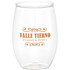 A clear stemless wine cup with an orange logo featuring decorative text. Suitable for enjoying beverages.