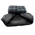 A picnic rug with a checkered pattern in green and navy, featuring a black waterproof backing. It has a logo on the edge.