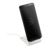 A wireless charging stand in silver with a sleek design, supporting a smartphone in an upright position.