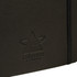 A black soft bound journal with an elastic closure and a logo embossed on the cover.