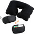 A black travel neck pillow, earplugs, and a small zippered pouch with various travel accessories.