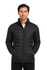 A black men's jacket with a zippered front and side pockets, featuring a puffy design and a logo.