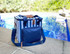 A navy cooler bag with blue and white stripes, featuring a shoulder strap and a front pocket. The bag has a logo.