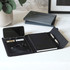 A5 RPET folio notebook in black, featuring a notepad, pen, card holder, and phone slot, with a grey folder in the background.