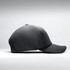 A black premium nylon cap featuring perforated detailing and a curved peak, with a logo on the side.