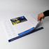 A3 notepad in white and blue, featuring a calendar layout and a section for notes, held by a hand.