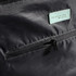 A close-up of the Swissdigital Arosa Duffle Bag in black, featuring a zippered pocket and a branding logo.