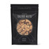 A snack mix bag contains salted nuts, featuring a variety of nuts in a black packaging with a logo.