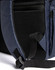 A navy blue backpack with mesh pockets and adjustable straps. It features a sleek design and exterior compartments.