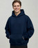 A man wearing a navy unisex premium fleece oversized hoodie with a front pocket and a hood.