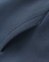 A close-up of a dark blue unisex premium fleece oversized hoodie, featuring a soft texture and seamless stitching.