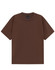A brown unisex heavy cotton oversized tee displayed flat, featuring a simple design and a label inside.