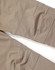 Flexible work pants in a tan colour, featuring detailed stitching and a subtle logo on the fabric.
