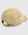A beige baseball cap with a curved brim, adjustable strap, and ventilation eyelets. It features a logo.